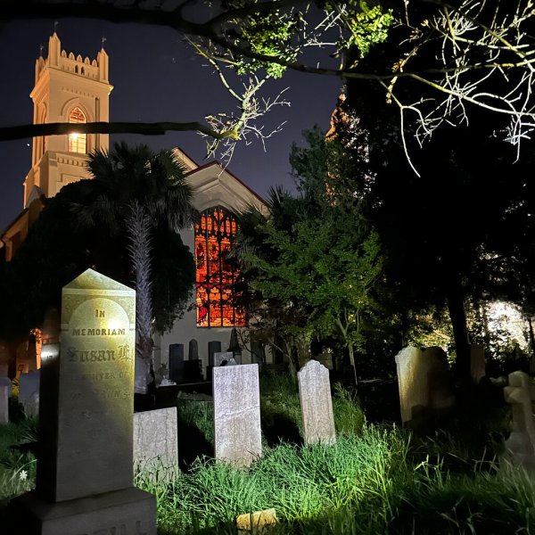 a pole that has a sign on the side of a building