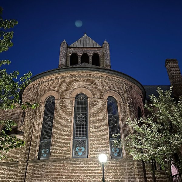 a clock tower in front of a building