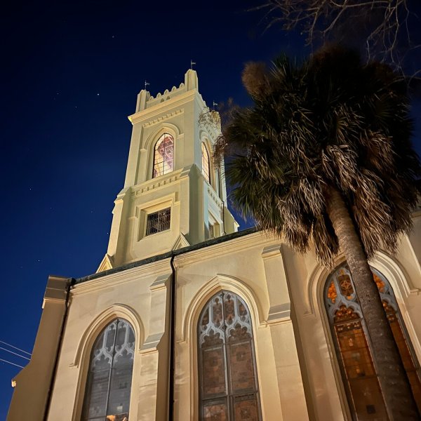 a church with a clock on the side of a building