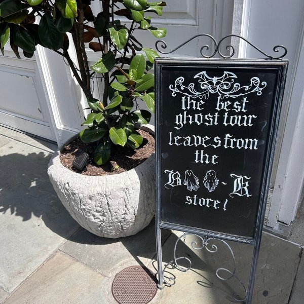 a sign on the side of a flower